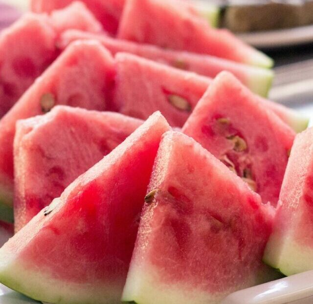 sliced watermelon in white ceramic tray on table