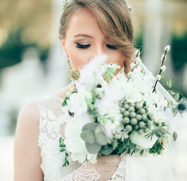 bride smelling the flowers