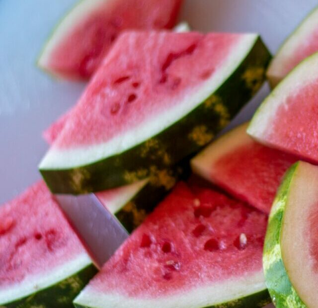 sliced watermelon on white plate