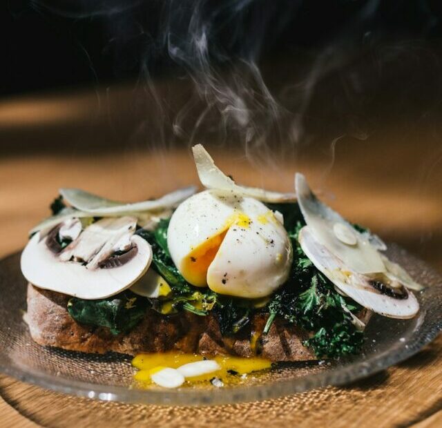 meat with egg and vegetable on top